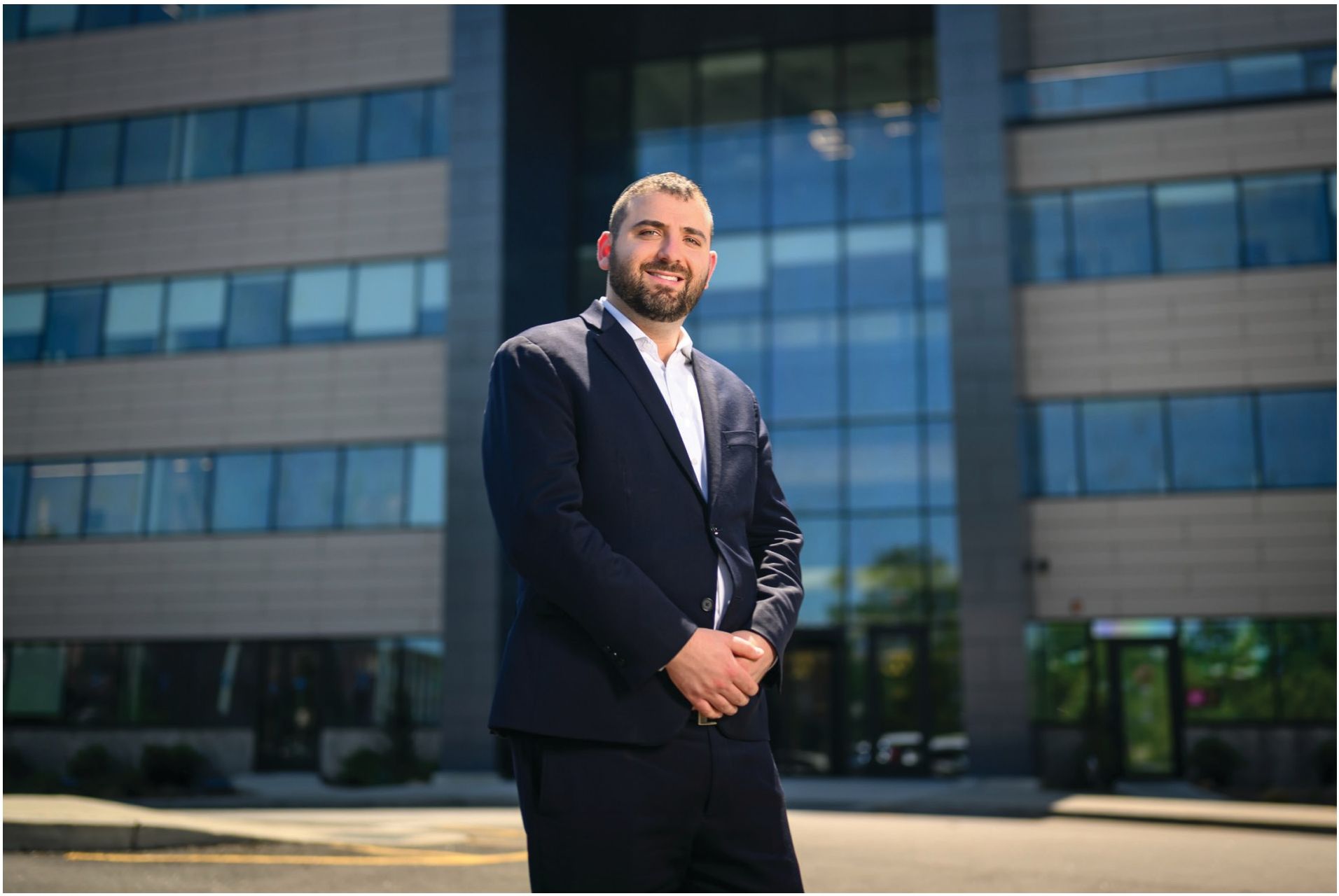 Leo Spitz standing in front of the BidMaster Solutions office building in West Orange, NJ