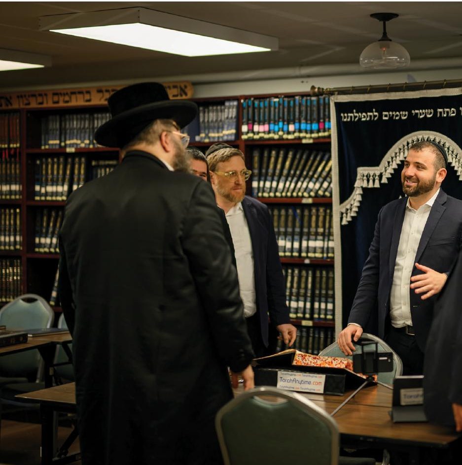 Leo Spitz recording his shiur for TorahAnytime at the BidMaster Solutions office